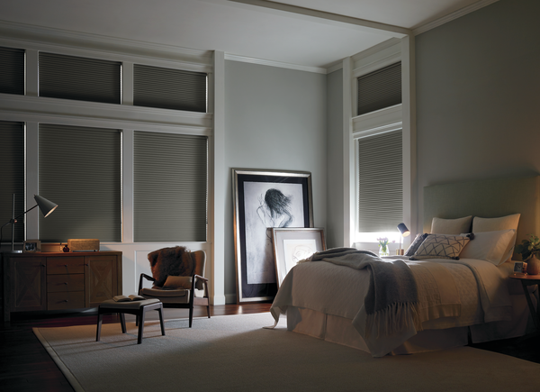 Bedroom using the Powerview system by Hunter Douglas to provide smart window treatments
