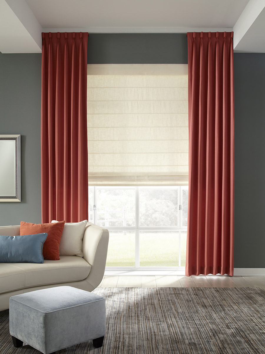 Roman shades with side panels in a bedroom 