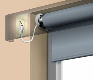 Electric roller blind plugged into a wall socket, demonstrating modern home automation.